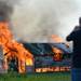 Firefighters watch as a small structure is engulfed in flames during a training exercise and controlled burn in 6700 block of Warner Rd. in Pittsfield Township on Thursday, May 9, 2013. Melanie Maxwell I AnnArbor.com